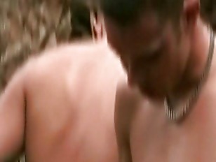 One guy blows three guys outdoor in the forest