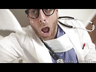Bearded doctor receives ass piercing from big boob shemale Kasey Kei